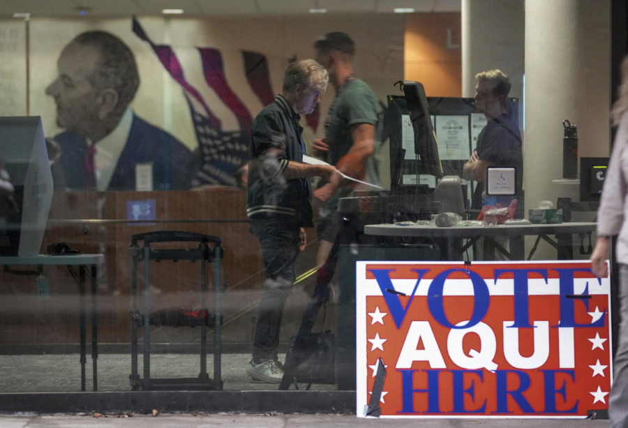 A man votes in the midterm elections at the Lyndon B. Johnson School of Public Affairs in Austin, Texas, on Tuesday Nov. 8, 2022. (Jay Janner/Austin American-Statesman via AP)