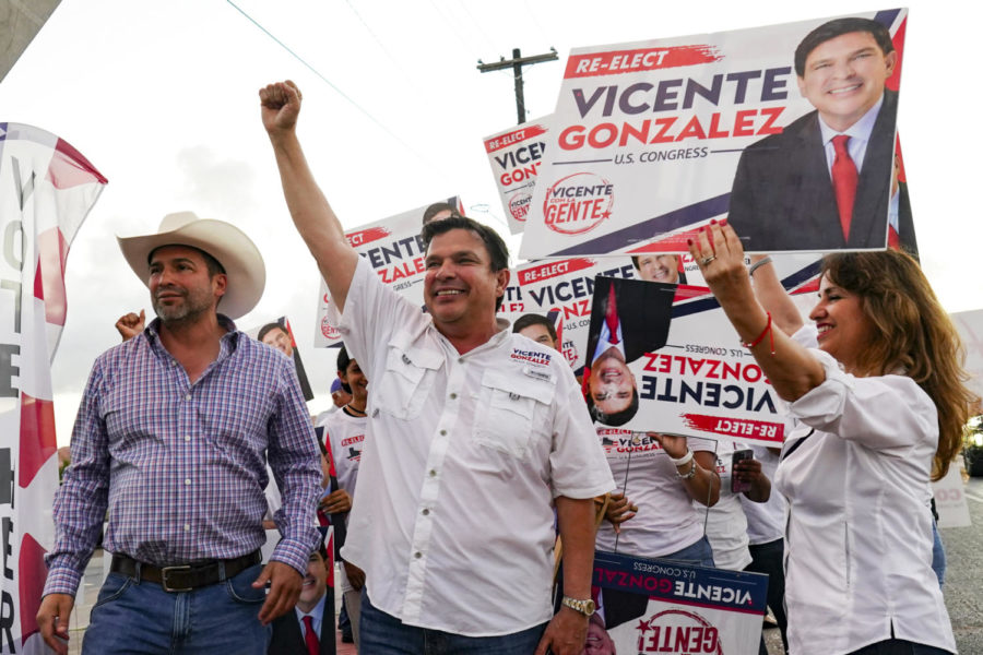 U.S. Representative for District 34 candidate Vicente Gonzalez films a video with his supporters urging people to vote Tuesday, Nov. 8, 2022, during Election Day for the Texas midterm elections at a polling location in Brownsville, Texas. (Denise Cathey/The Brownsville Herald via AP)