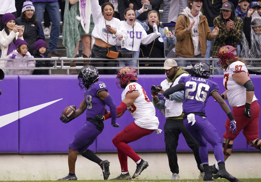 TCU safety Millard Bradford runs in an interception for touchdown in front of Iowa State tight end DeShawn Hanika (83) during the first half of an NCAA college football game in Fort Worth, Texas, Saturday, Nov. 26, 2022. (AP Photo/LM Otero)