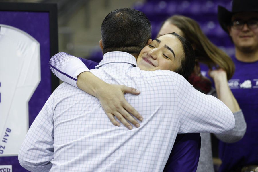 Callie Williams and Jason Williams hugging after TCU  Volleyball played Kansas State in Fort Worth, Texas on November 19, 2022. (Photo by/Ellman Photography)