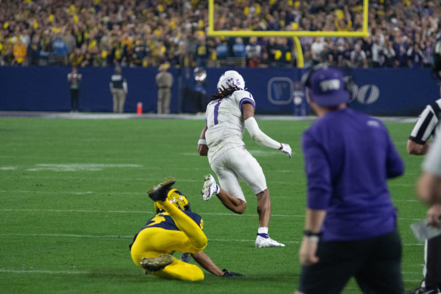 TCU WR Quentin Johnston caught a pass from QB Max Duggan on 3rd down. He made the Michigan defender miss a tackle and ran 76 yards for a touchdown. Dec. 31, 2022. (Tristen Smith/Staff Photographer).