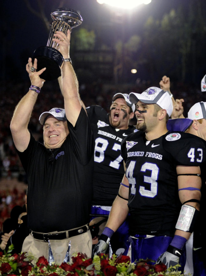 FILE - This Jan. 1, 2011 file photo shows TCU head coach Gary Patterson holding up the Rose Bowl Trophy after defeating Wisconsin in the Rose Bowl NCAA college football game, in Pasadena, Calif. People with knowledge of the decision say Big 12 leaders have agreed to invite TCU to join the fractured league as early as the 2012 football season. The offer to TCU will be extended sometime in the next few days, according to two people with ties to the Big 12. The people spoke only on condition of anonymity because the league has not announced the decision. (AP Photo/Mark J. Terrill, File)