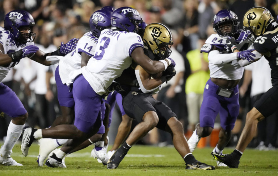 TCU safety Mark Perry (3) sacks Colorado quarterback Brendon Lewis (12) in the first half of an NCAA college football game Friday, Sept. 2, 2022, in Boulder, Colorado. Transfers have made major impacts around the Big 12, none more than at surprising unbeatens TCU and Kansas. (AP Photo/David Zalubowski)