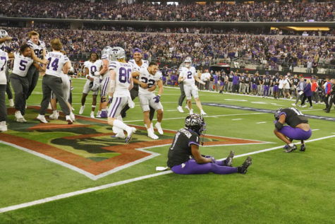Kansas State players celebrate as TCUs TreVius Hodges-Tomlinson (1) sits in the end zone with Dee Winters (13) after Kansas State defeated TCU in overtime of the Big 12 Conference championship game, Dec. 3, 2022, in Arlington, Texas. (AP Photo/LM Otero)