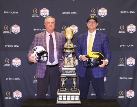 TCU head coach Sonny Dykes and Michigan head coach Jim Harbaugh pose with the Fiesta Bowl trophy ahead of the College Football Playoff semifinal. Dec. 30, 2022. (Photo courtesy of Jonathan Mouer/Fiesta Bowl Media)