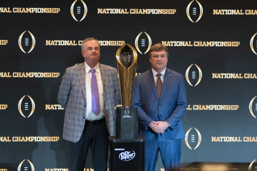 TCU+and+Georgia+head+coaches+Sonny+Dykes+and+Kirby+Smart%2C+respectively%2C+stand+with+the+national+championship+trophy%2C+Jan.+8%2C+2023.+%28Tristen+Smith%2FStaff+Photographer%29