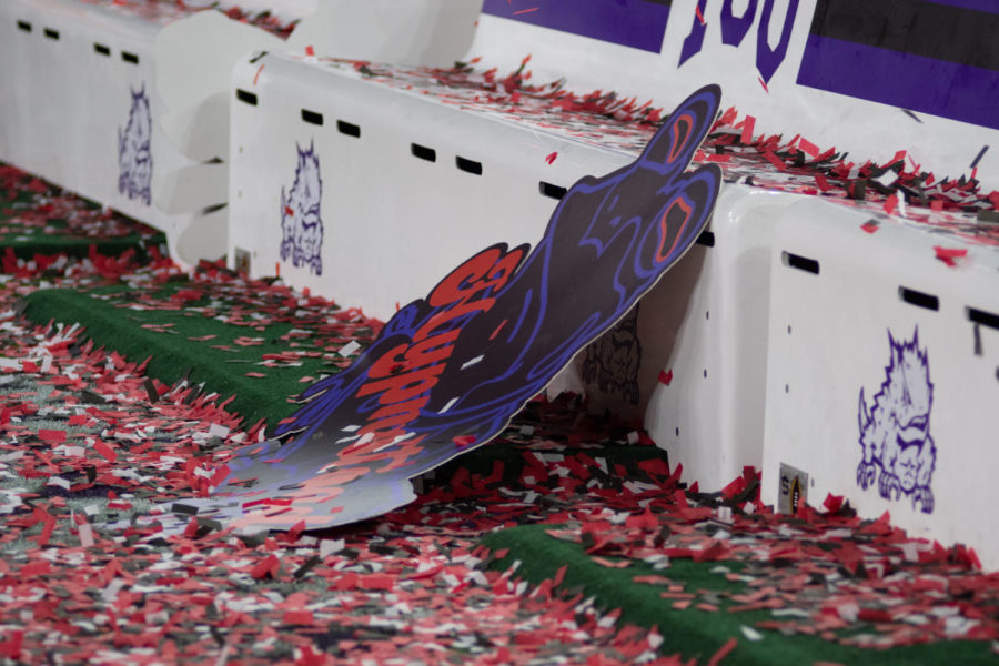 The Hypnotoad became a famous theme throughout TCUs playoff run. A Hypnotoad poster was left covered in Georgia confetti after TCU lost the national championship 65-7, Jan. 9, 2023. (Tristen Smith/Staff Photographer)
