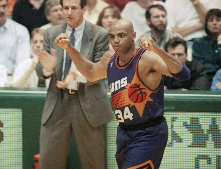 Phoenix s Charles Barkley celebrates as his coach Paul Westphal cheers him on as they rolled to a 104-97 victory over the SuperSonics at Seattle, May 28, 1993. (AP Photo/Bill Chan, File)