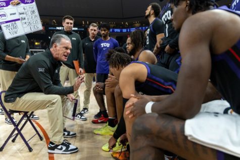 TCU head coach Jamie Dixon leads a discussion during a timeout vs Texas on Jan. 11, 2023. (Photo courtesy of GoFrogs.com)