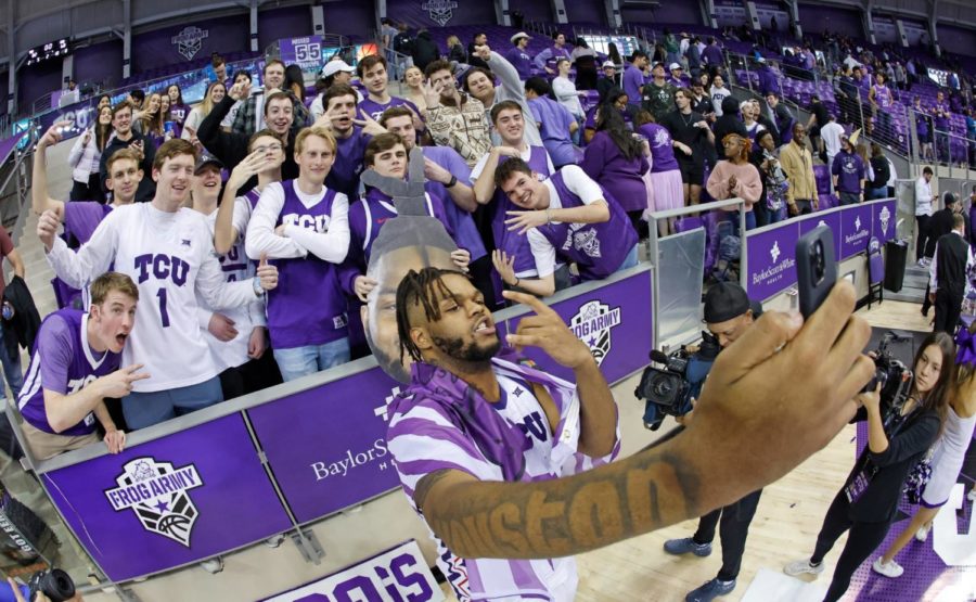 TCU+center+Eddie+Lampkin+Jr.+takes+pictures+with+students+vs+Kansas+State+on+Jan.+14%2C+2023.+%28Photo+courtesy+of+GoFrogs.com%29