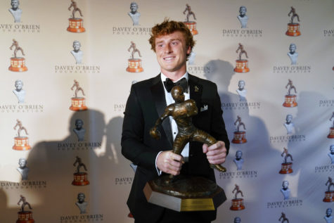 TCU quarterback Max Duggan smiles for photos with the Davey OBrien Award in Fort Worth, Texas, Monday, Feb. 20, 2023. (AP Photo/LM Otero)