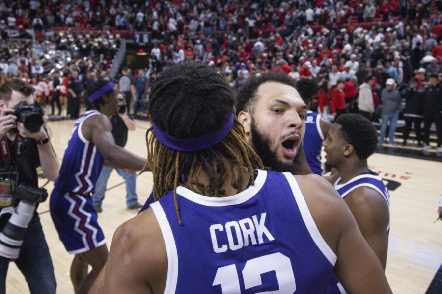 TCUs Xavier Cork (12) and JaKobe Coles (21) celebrate a win over Texas Tech after an NCAA college basketball game on Saturday, Feb. 25, 2023 in Lubbock, Texas. (AP Photo/Chase Seabolt)