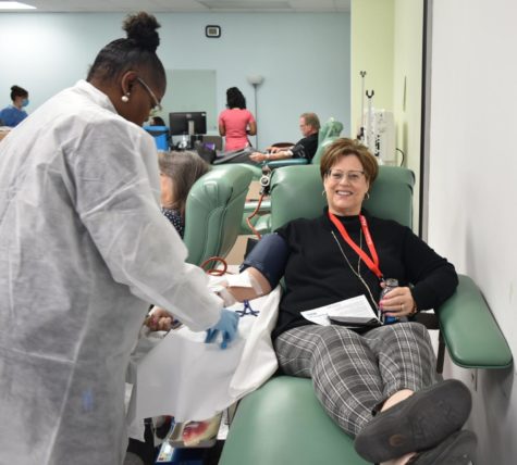 A phlebotomist, or health care worker trained in drawing blood, checks the donors progress at a Carter BloodCare center. The whole blood donation process, from check-in to departure, takes less than an hour, said James Black, a Carter BloodCare spokesperson. (Photo by Carter BloodCare)
