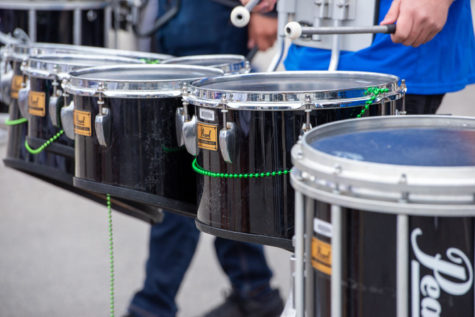 Drummers march in the Race Street Mardi Gras parade. (Lance Sanders/TCU 360)