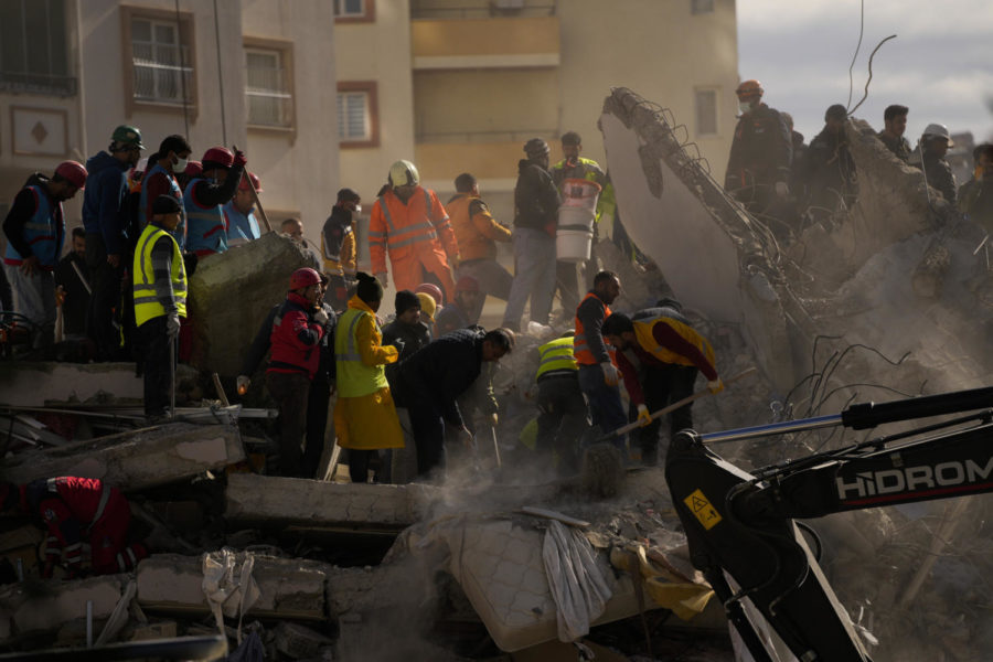 Rescue workers search for survivors on a collapsed building in Malatya, Turkey, Tuesday, Feb. 7, 2023. Search teams and aid are pouring into Turkey and Syria as rescuers working in freezing temperatures dig through the remains of buildings flattened by a magnitude 7.8 earthquake. (AP Photo/Emrah Gurel) (AP)