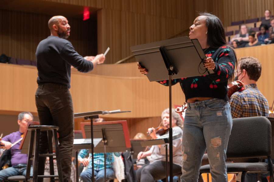 Geter, left, directs soprano soloist Brandie Sutton, right, in An African American Requiem with the Fort Worth Symphony Orchestra and Fort Worth Opera Chorus. A hologram of Sutton, dressed and singing as an enslaved woman, is in the permanent collection of the Legacy Museum in Montgomery, Alabama.