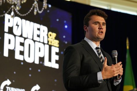 Turning Point USA founder Charlie Kirk introduces Brazils right wing ex-president Jair Bolsonaro, at a TPUSA event at Trump National Doral Miami, Friday, Feb. 3, 2023, in Doral, Fla. (AP Photo/Rebecca Blackwell)