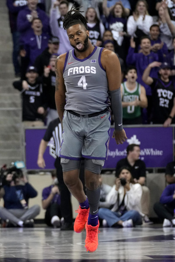 TCU center Eddie Lampkin Jr. (4) celebrates after sinking a three-point shot in the first half of an NCAA college basketball game against Oklahoma State, Saturday, Feb. 18, 2023, in Fort Worth, Texas. (AP Photo/Tony Gutierrez)