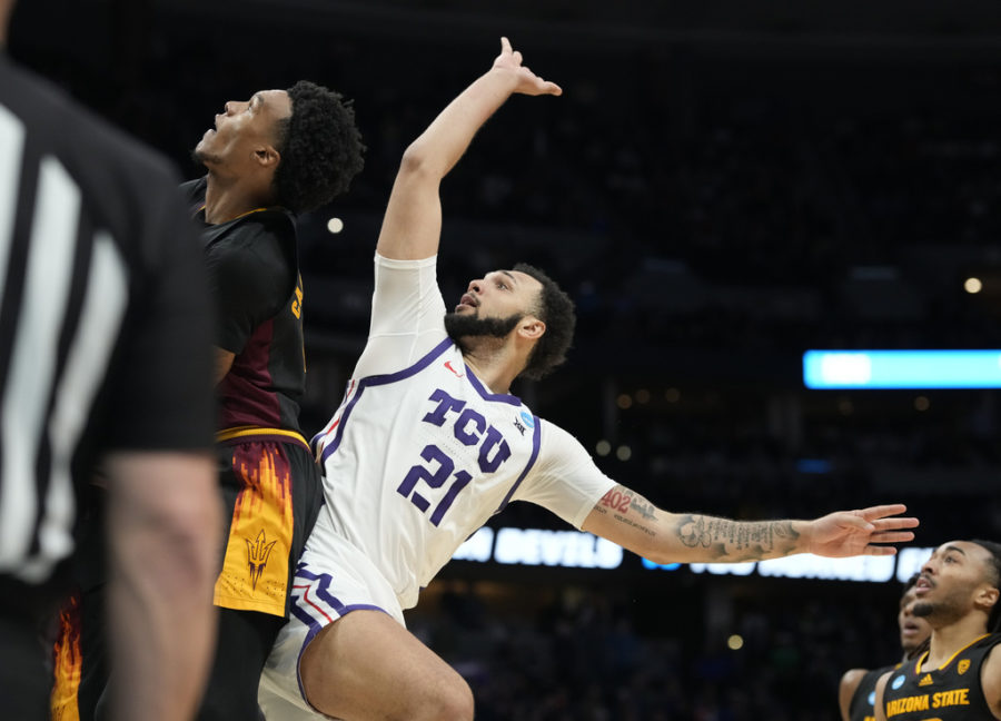 TCU forward JaKobe Coles (21) hits the go-ahead basket over Arizona State guard Desmond Cambridge Jr. during a first-round college basketball game in the mens NCAA Tournament on Friday, March 17, 2023, in Denver. (AP Photo/David Zalubowski)