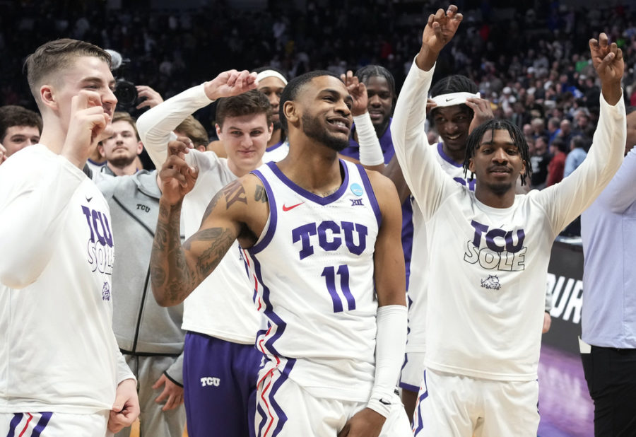 TCU guard Rondel Walker, center, and teammates celebrate a win over Arizona State in a first-round college basketball game in the mens NCAA Tournament on Friday, March 17, 2023, in Denver. (AP Photo/David Zalubowski)