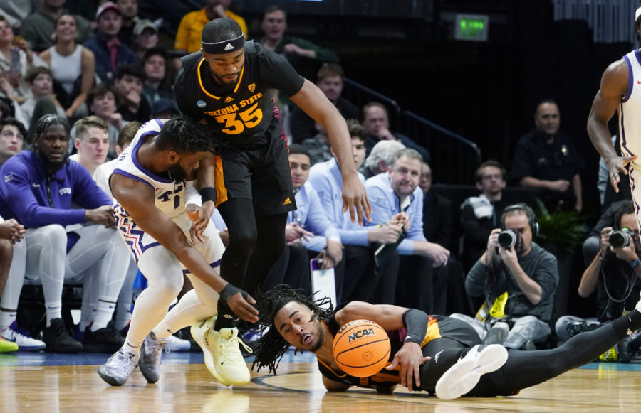Arizona State guard Frankie Collins, right, tries to get control of the ball in front of guard Devan Cambridge, center, and TCU guard Mike Miles Jr. during the second half of a first-round college basketball game in the mens NCAA Tournament on Friday, March 17, 2023, in Denver. (AP Photo/John Leyba)