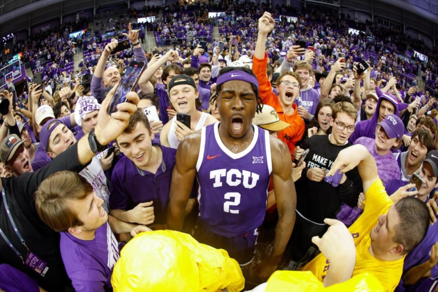 TCU forward Emanuel Miller celebrates with fans vs Texas on March 1, 2023. (Photo courtesy of GoFrogs.com)