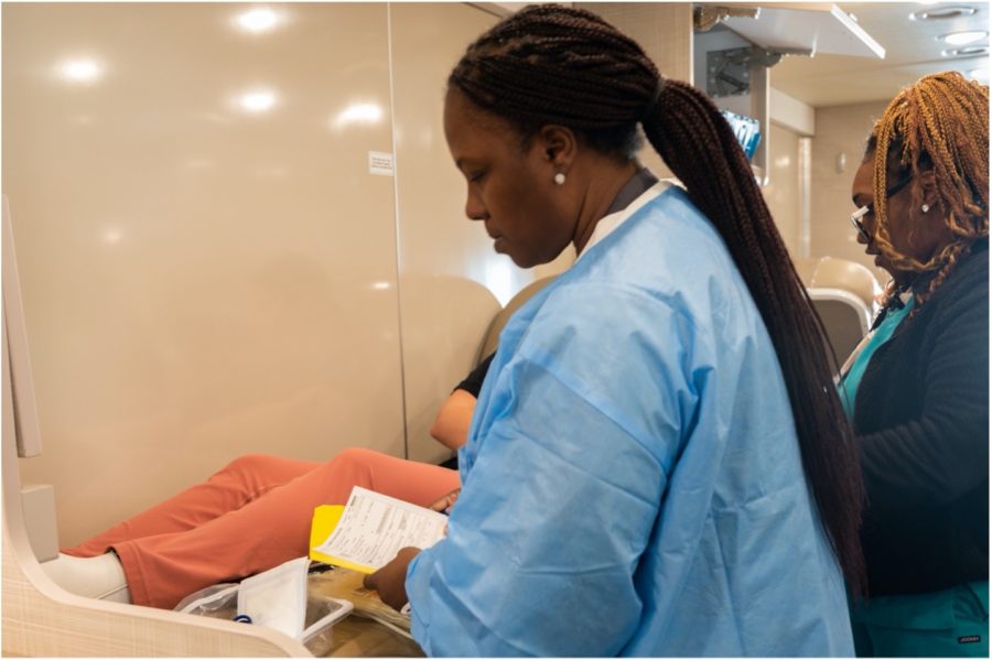 Nikki Gordon, left, a Carter BloodCare phlebotomist for 14 years, reviews the paperwork one last time as part of the donation procedure. Destiny Milam, right, has been a Carter phlebotomist for two years. Phlebotomists are health care professionals who are trained to draw blood. 