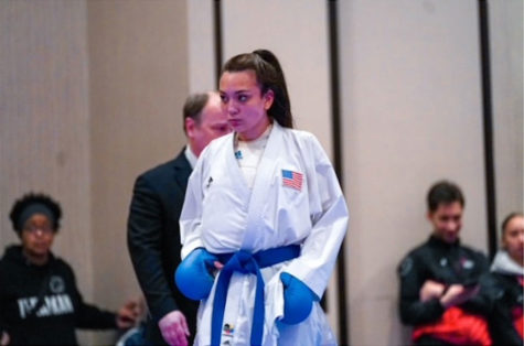 Junior Alex Wainwright competes in a karate competition, donning Team USA apparel. (photo courtesy of: Steve Wainwright).