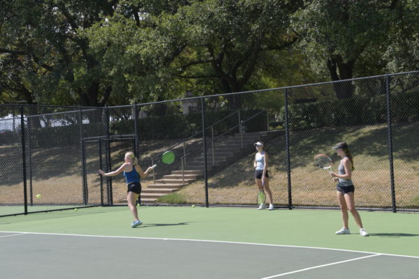 A doubles team warming up before practice. (Katie Mitchell/Staff Writer)
