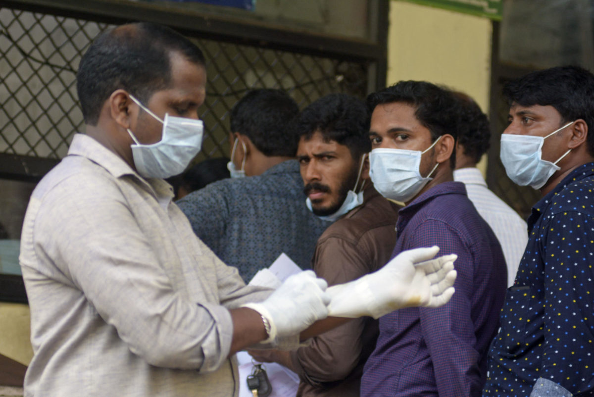 Indians standing in a queue outside a hospital wear masks as a precautionary measure against the Nipah virus at the Government Medical College hospital in Kozhikode, in the southern Indian state of Kerala, Monday, May 21, 2018. The deadly virus has killed at least three people in southern India, officials said Monday, with medical teams dispatched to the area amid reports that up to six other people could have died from the disease and others are ill. (AP Photo)