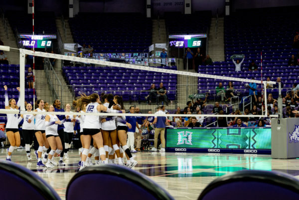 TCU Volleyball celebrating after defeating Hawaii in Schollmaier Arena.