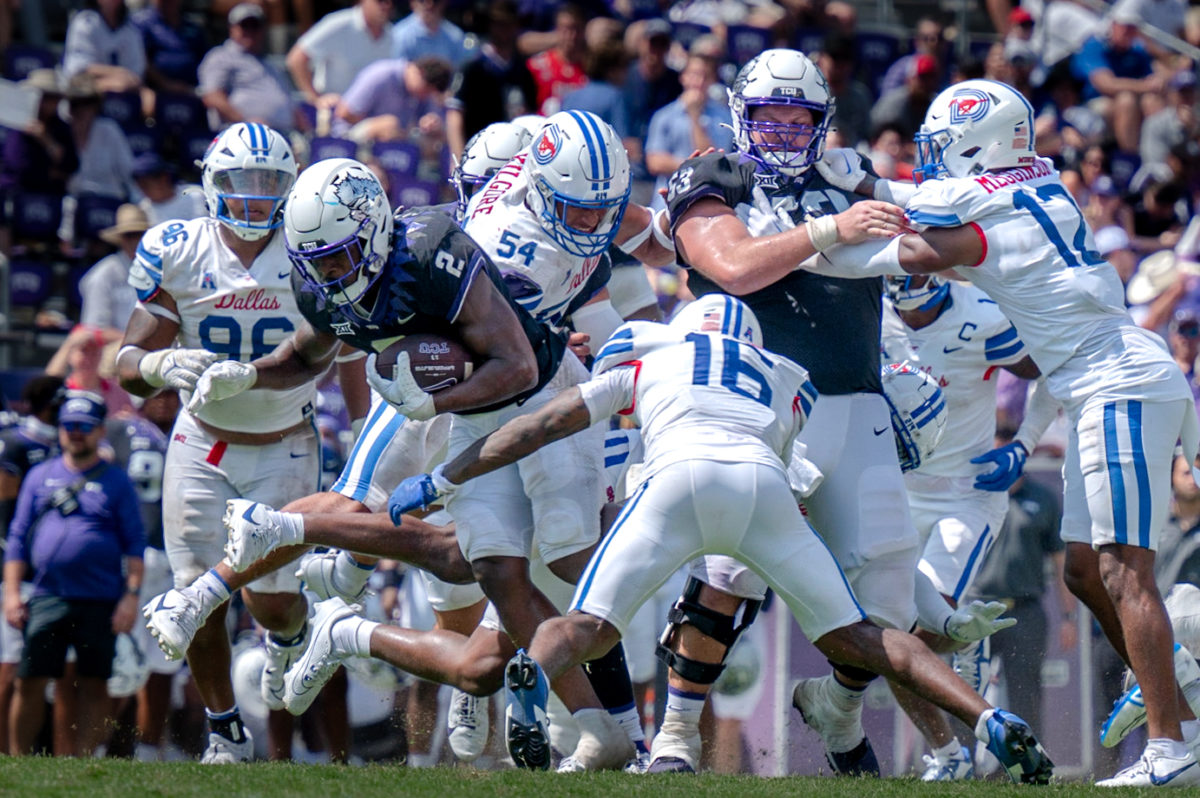 TCU running back Trey Sanders pushes through defenders at the 102nd Battle for the Iron Skillet, 2023. The Horned Frogs beat the SMU Mustangs 34-17. (TCU 360/Shane Manson)
