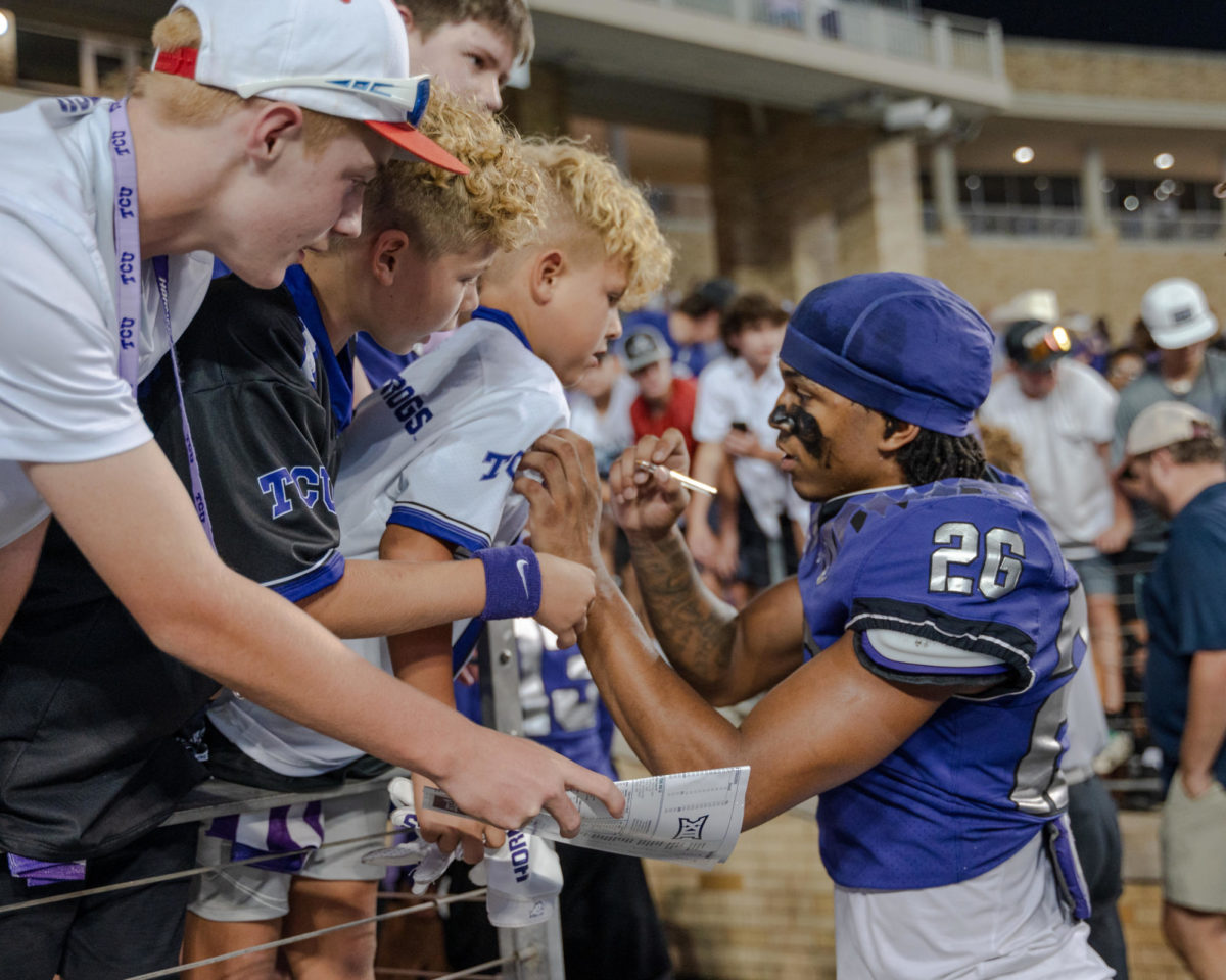 Texas Christian University cornerback Vernon Glover takes a moment to greet a young fan at Amon G. Carter Stadium in Fort Worth, Texas, Sept. 9, 2023. The TCU Horned Frogs beat the Nicholls State Colonels 41-6. (TCU 360/ Shane Manson)