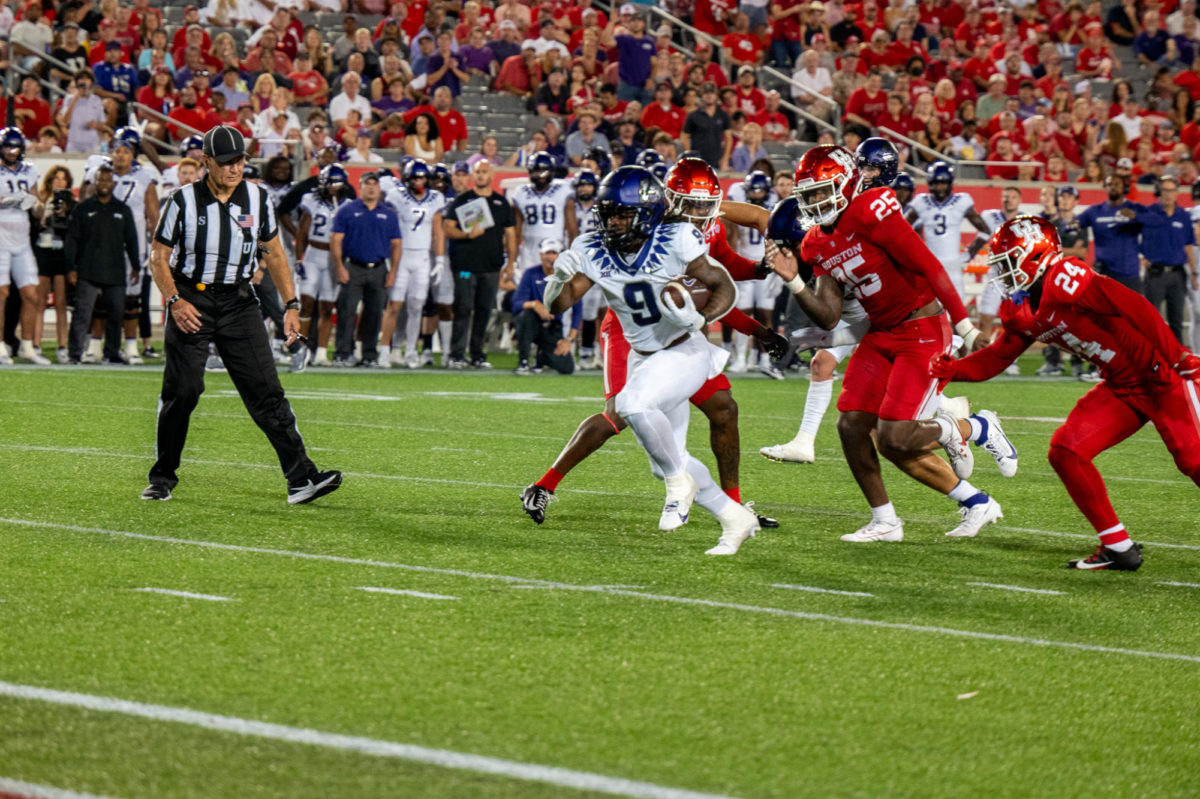 Texas Christian University running back Emani Bailey takes off a against the Houston Cougars defense at TDECU Stadium in Houston, Texas, Sept. 16, 2023. Bailey rushed for 126 yards with one touchdown. (TCU 360/ Lance Sanders)