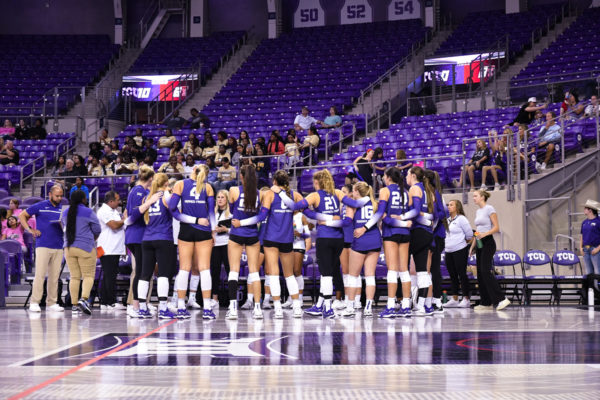 The TCU Volleyball team in a huddle during a time out in the match against Texas Tech on Thursday, Sept. 28 in the Schollmaier Arena.