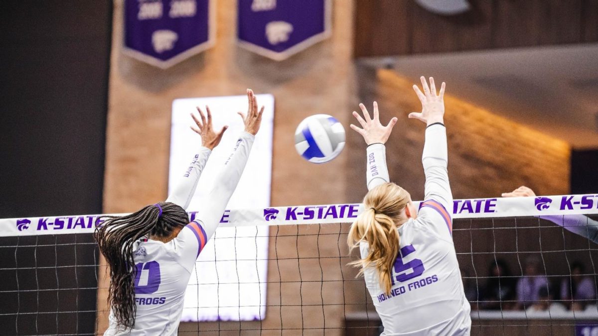 Middle Blocker Brianna Green and Outside Hitter Audrey Nalls go up for a block against the Kansas State Wildcats. (Photo courtesy of: gofrogs.com)