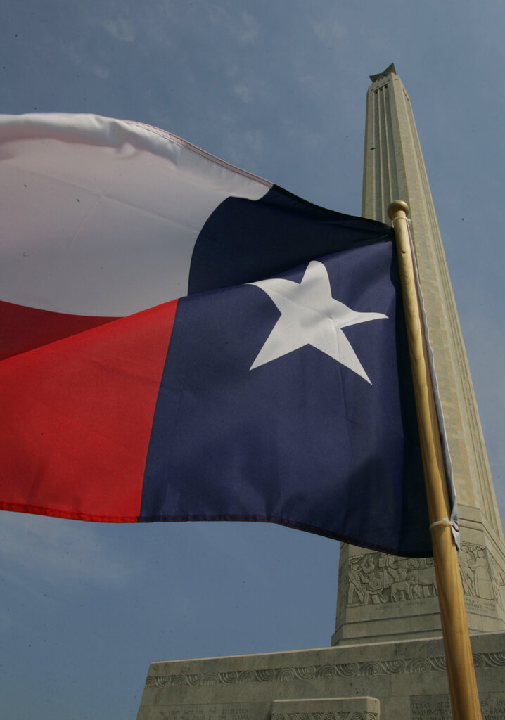 A Texas flag flies outside the San Jacinto Monument in La Porte, Texas, Thursday, Sept. 7, 2006.