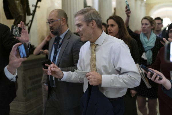 Rep. Jim Jordan, R-Ohio, chairman of the House Judiciary Committee followed by reporters walks to his office after a Republican caucus meeting at the Capitol in Washington, Tuesday, Oct. 17, 2023. (AP Photo/Jose Luis Magana)