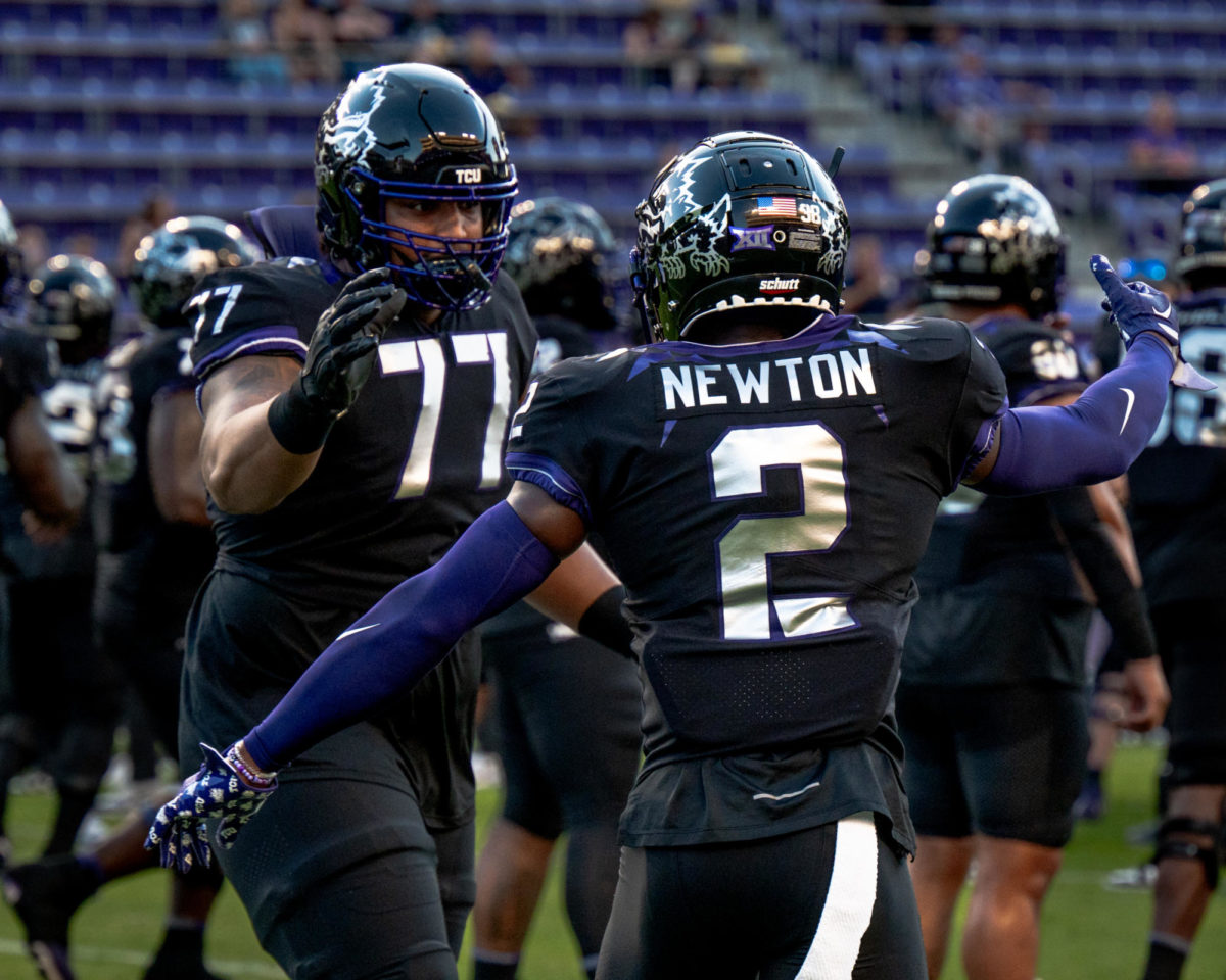 Texas Christian University players Josh Newton and Brandon Coleman take the field at Amon G. Carter Stadium in Fort Worth, Texas, Sept. 30, 2023. The TCU Horned Frogs were defeated by the West Virginia Mountaineers 24-21. 