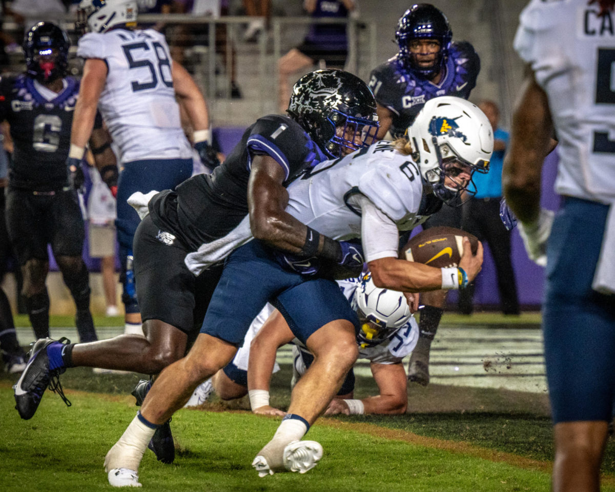 Texas Christian University safety Abe Camara attempts a tackle at Amon G. Carter Stadium in Fort Worth, Texas, Sept. 30, 2023. The TCU Horned Frogs were defeated by the West Virginia Mountaineers 24-21. (TCU 360/ Shane Manson)