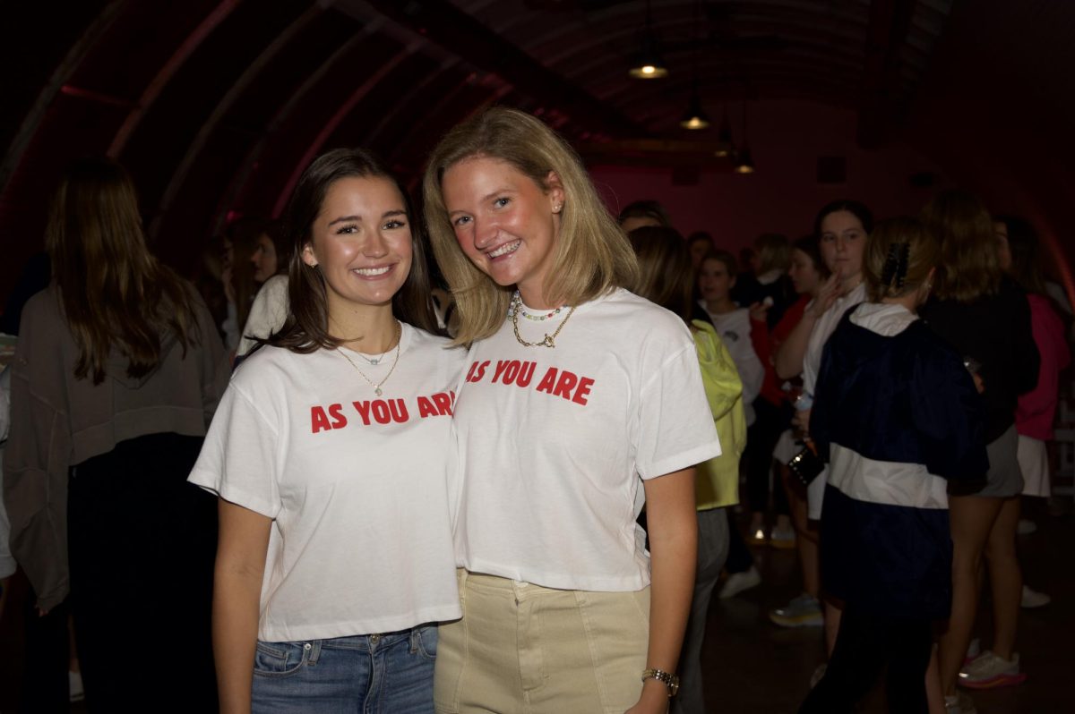 Emily Rose Benefield (left) and McKeever Wright (right) come together for a photo at an As You Are Worship Night. 