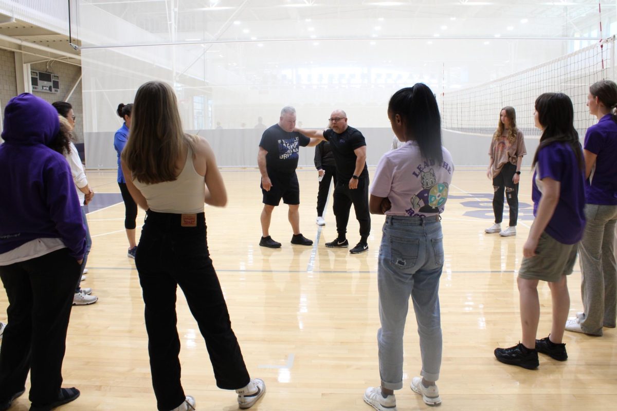 Sgt. Rich Martinez and Commander Fred Long teach students techniques in Self-Defense Class. (Sasha Chapman/Staff Writer)