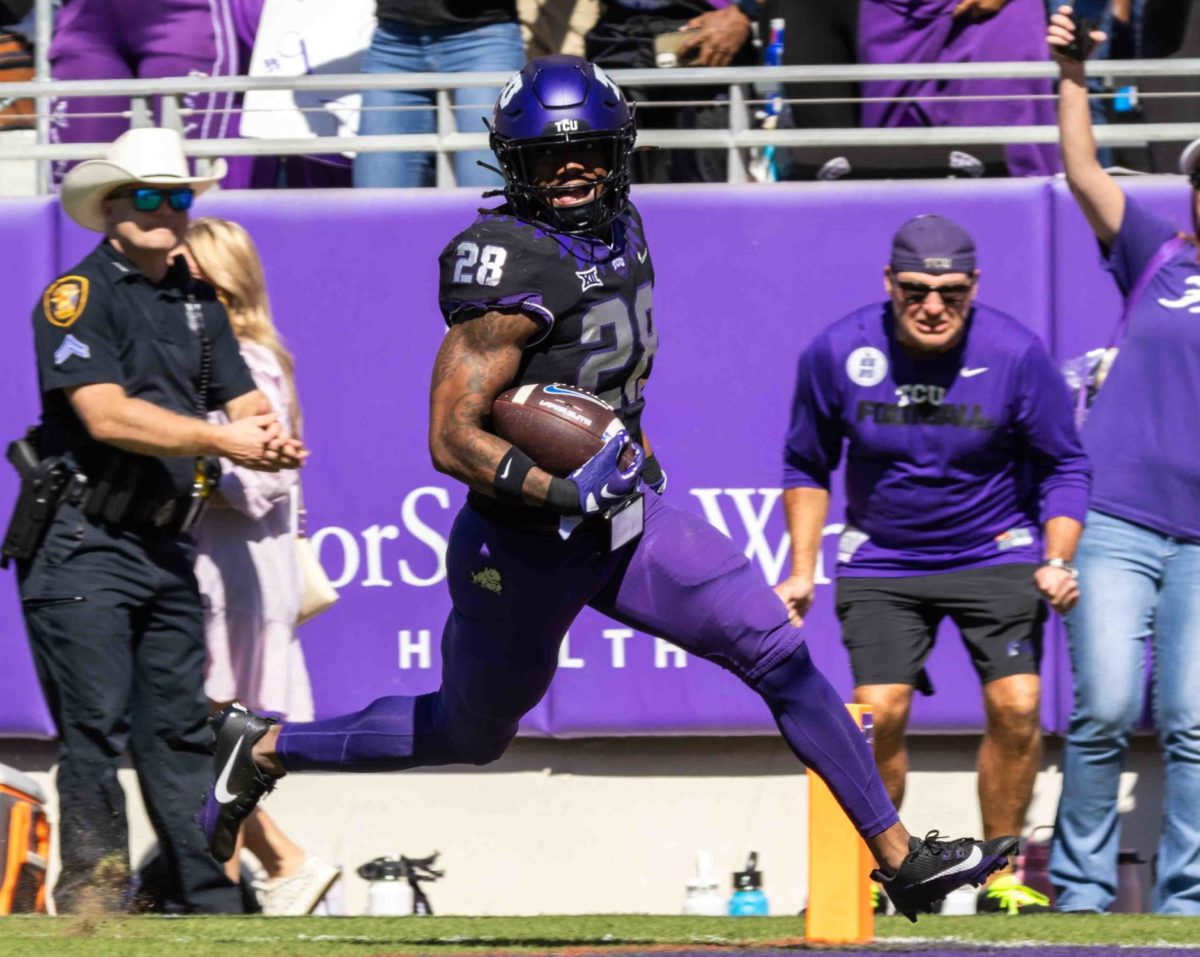 Texas Christian University safety Millard Bradford returns an interception for a touchdown as the Horned Frogs defeated the BYU Cougars 44-11. (TCU 360/ Tyler Chan) 