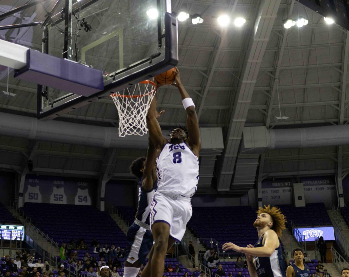 Texas Christian University center Ernest Udeh Jr. dunks the ball in the basket at Schollmaier Arena in Fort Worth, Texas on October 30th, 2023. The TCU Horned Frogs would beat the Texas Wesleyan Rams 98-61 in an exhibition game. (TCU360/Tyler Chan)