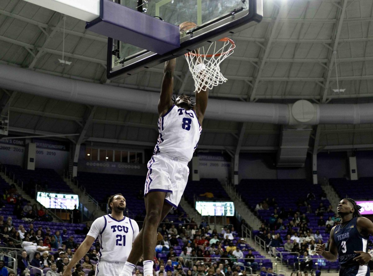 Texas Christian University center Ernest Udeh Jr. dunks the ball in the basket at Schollmaier Arena in Fort Worth, Texas on October 30th, 2023. The TCU Horned Frogs would beat the Texas Wesleyan Rams 98-61 in an exhibition game. (TCU360/Tyler Chan)