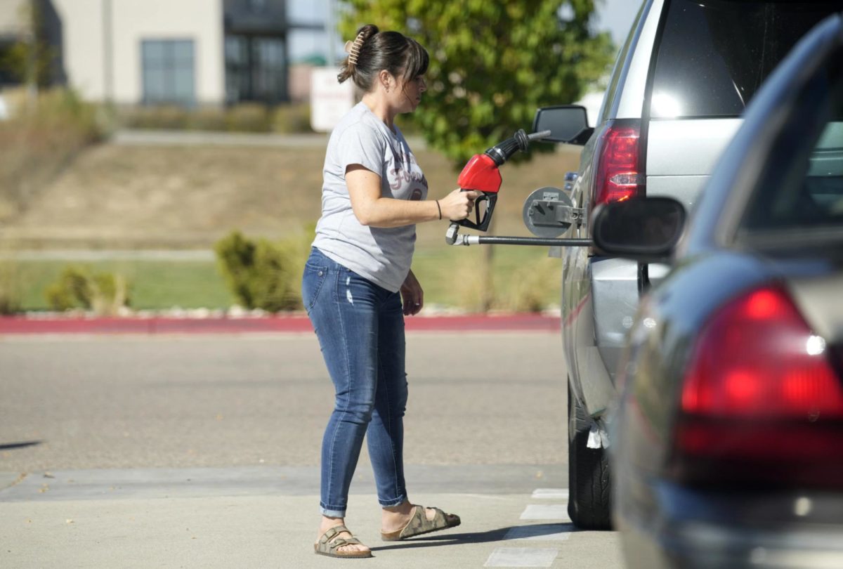 A motorist prepares to fill up her vehicle with gasoline at a Costco warehouse Thursday, Oct 5, 2023, in Timnath, Colo. ON Thursday, the Labor Department issues its report on inflation at the consumer level. (AP Photo/David Zalubowski) 