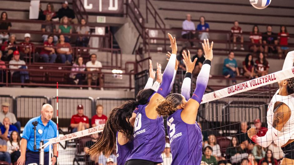 Outside hitter Jalyn Gibson, middle blocker Brianna Green and outside hitter Melanie Parra going up for a 3-person block against the Oklahoma Sooners at the McCasland Field House in Norman, Ok.