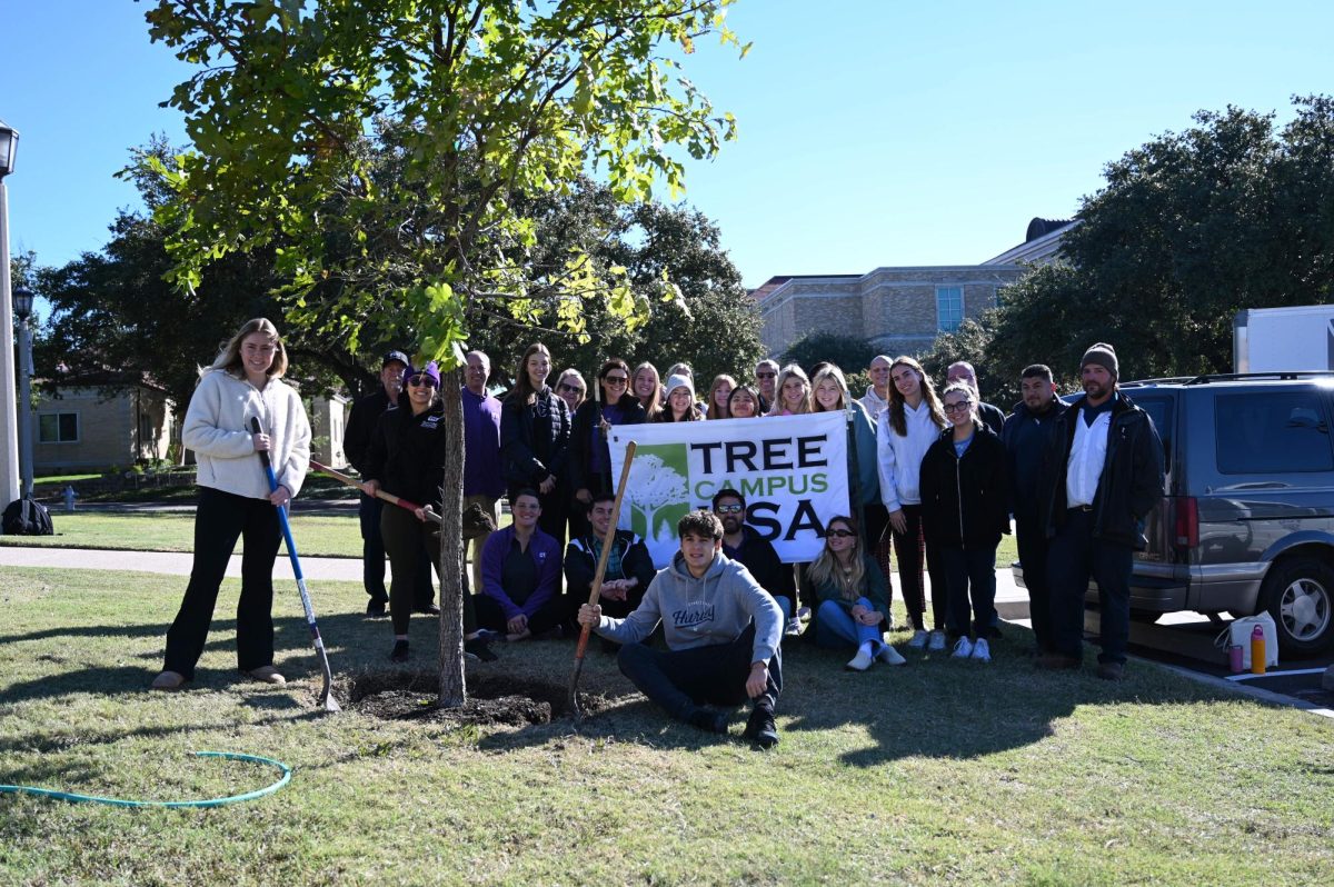 Approximately 30 people attended the Texas Arbor Day celebration to help plant three new bur oaks outside Dee J. Kelly Alumni & Visitors Center on Nov. 2. (Cecilia Le/Staff Writer)