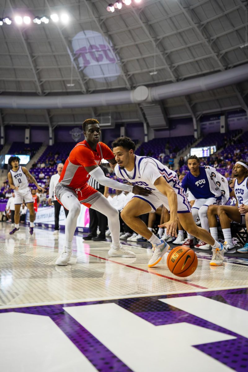 Trevian Tennyson dribbles baseline to get around his defender to look for an open shot at Ed and Rae Schollmaier Arena in Fort Worth, Texas on November 14th, 2023. The TCU Horned Frogs beat the UTRGV Vaqueros 88-55. (TCU360/ Caden Polansky)