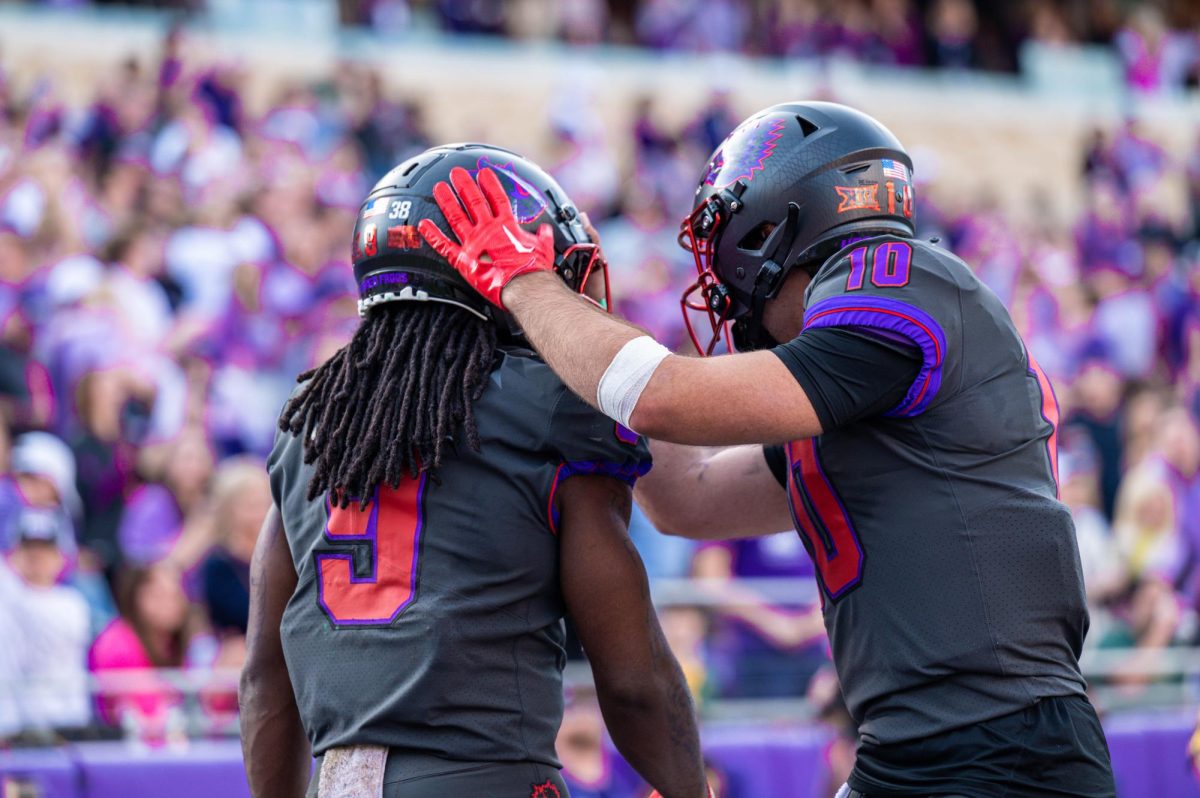 TCU+running+back+Emani+Bailey+congratulated+by+his+teammate.+Bailey+rushed+for+53+yards+and+two+touchdowns+against+Baylor.+